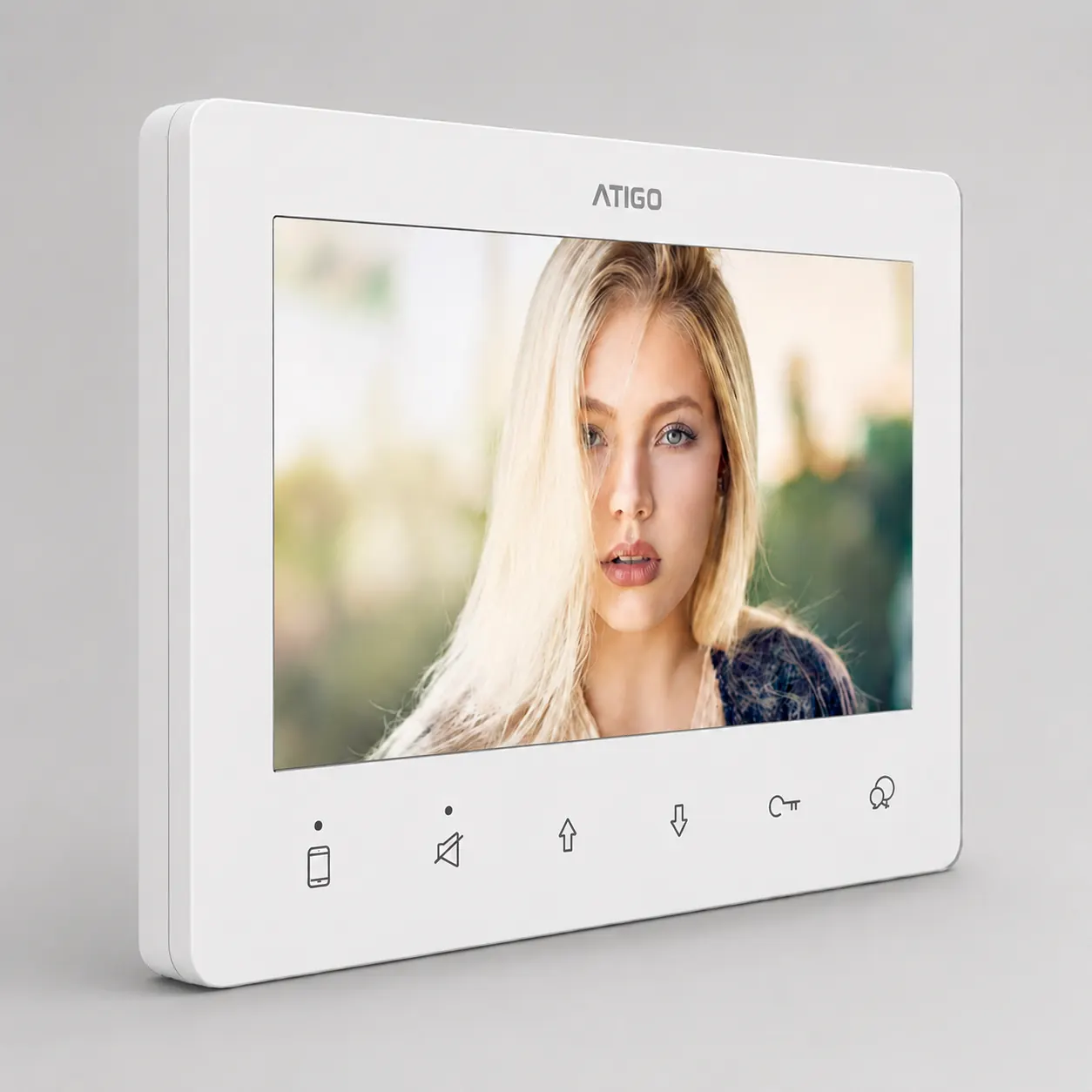 Video intercom monitor showing a visitor on screen.